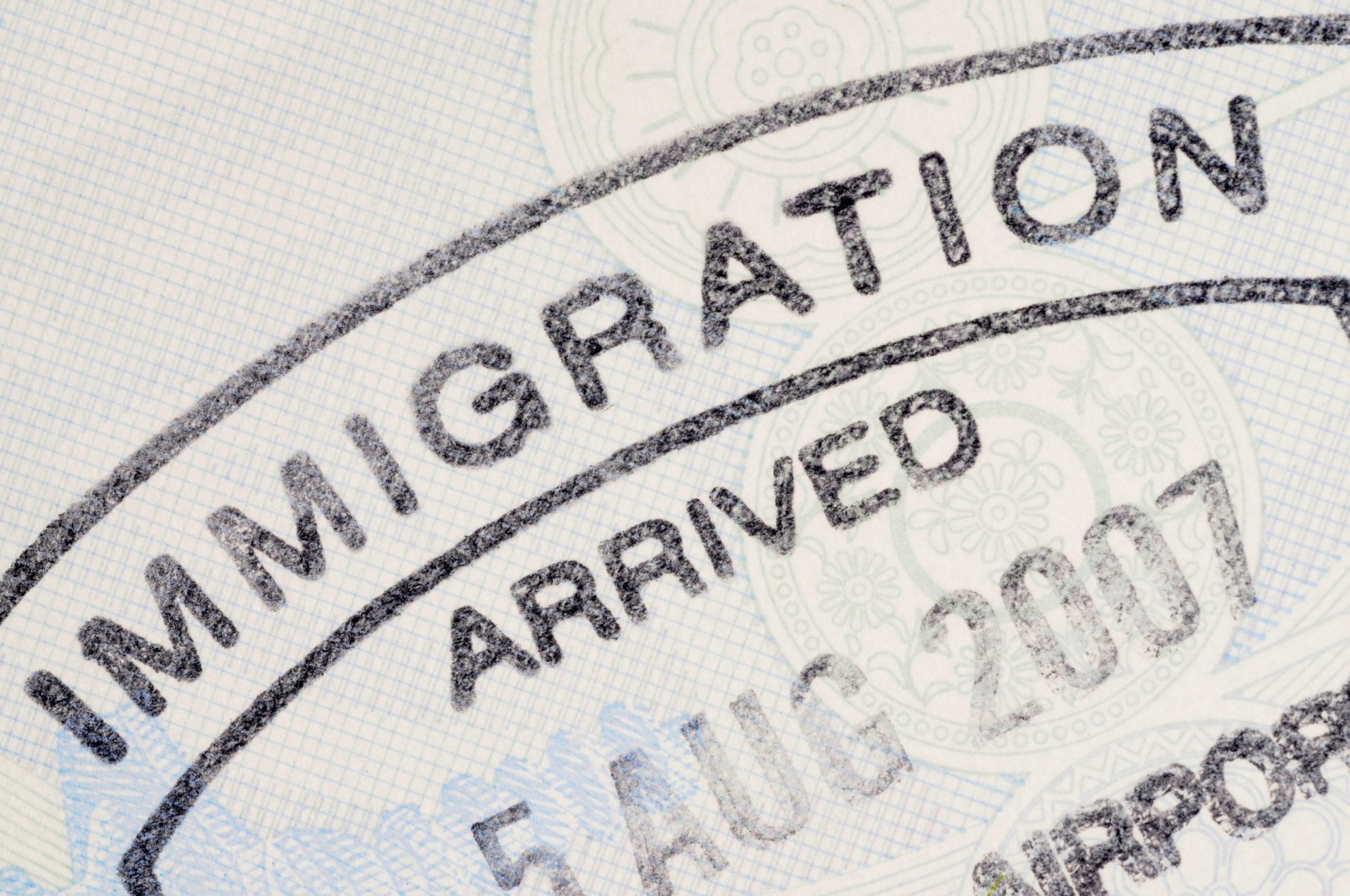 A close-up of an official immigration passport stamp